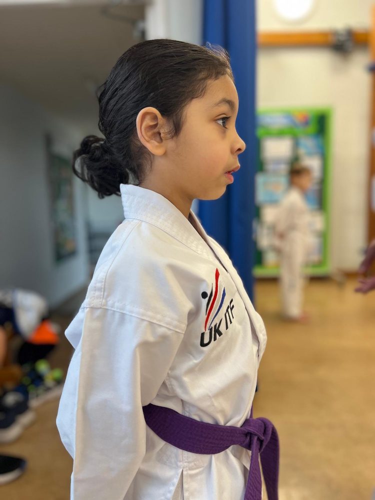Generation X student in a UK ITF dobok and purple belt