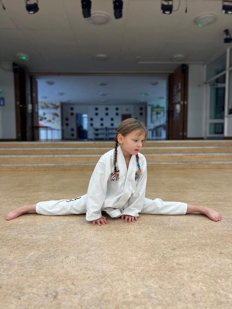 Young student stretching in the splits