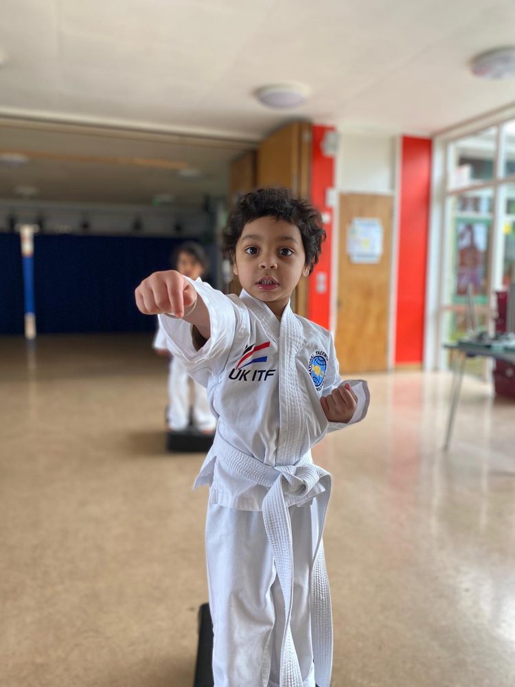 White belt student throwing a punch